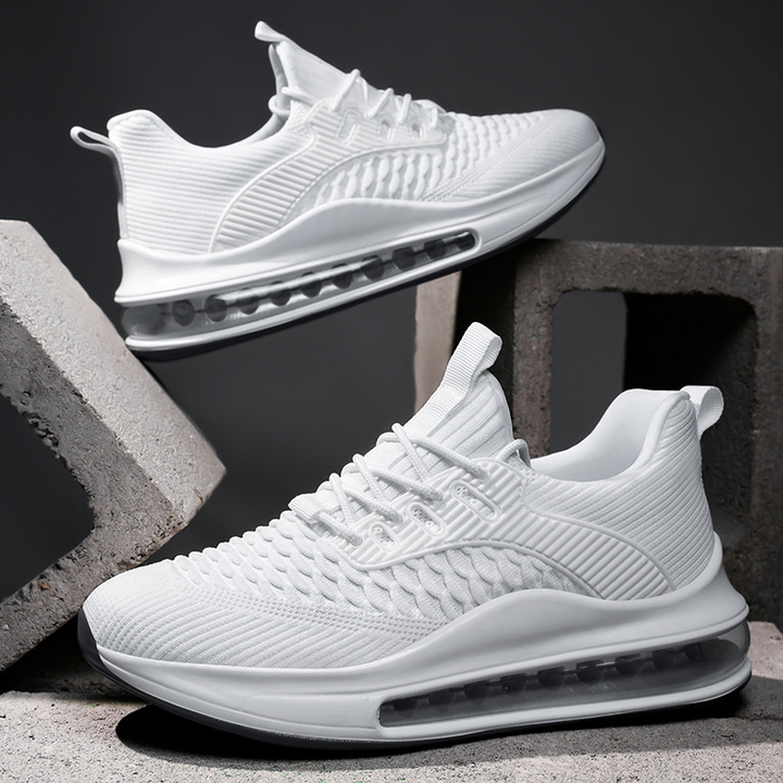 Men's Airvault Max running sneakers in motion, providing cushioned performance for athletic activities.
