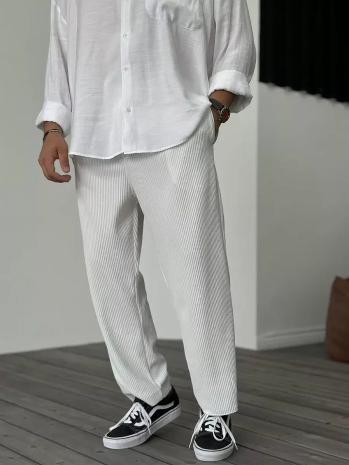 Full-length shot of men's Alessio luxury soft fabric trousers, showcasing elegant drape & tailored fit.