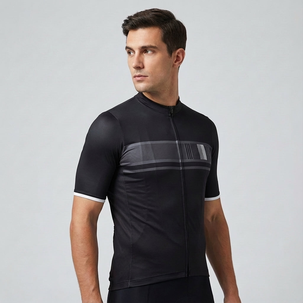 Cyclist wearing men's Alfred aerodynamic race fit jersey, on a road bike, blurred background