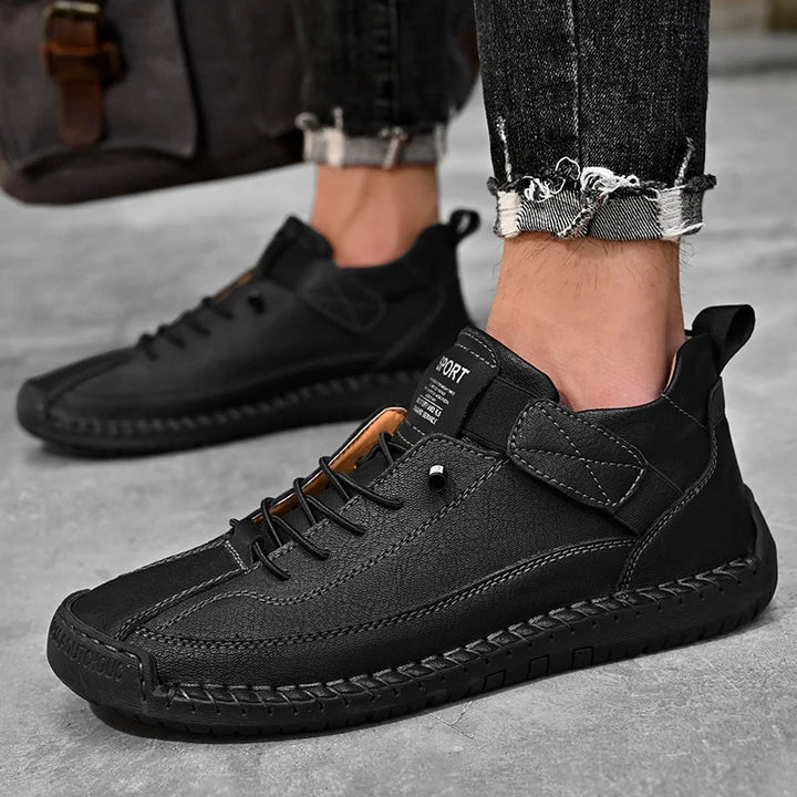 Man hiking in men's all-terrain sneakers, showcasing durability and grip in natural terrain.