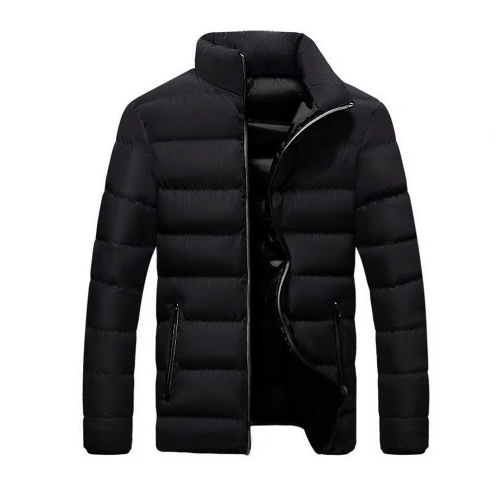 Man wearing a lightweight, warm men's Alpine Crest quilted jacket outdoors, perfect for fall activities.