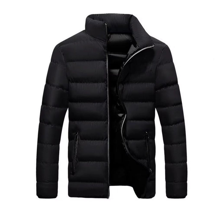 Man wearing a lightweight, warm men's Alpine Crest quilted jacket outdoors, perfect for fall activities.