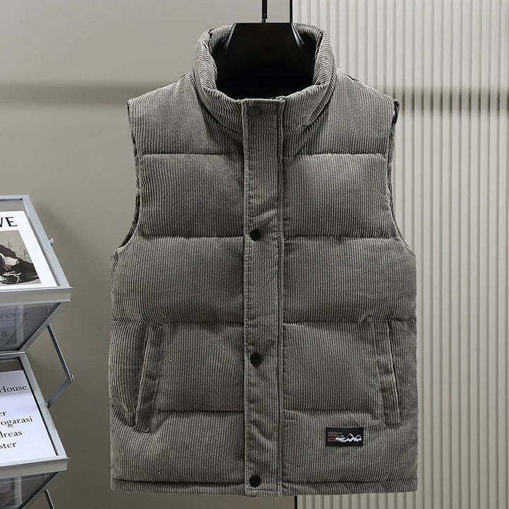 Close-up of men's ribbed puffer vest texture, a warm and casual sleeveless jacket for winter style.