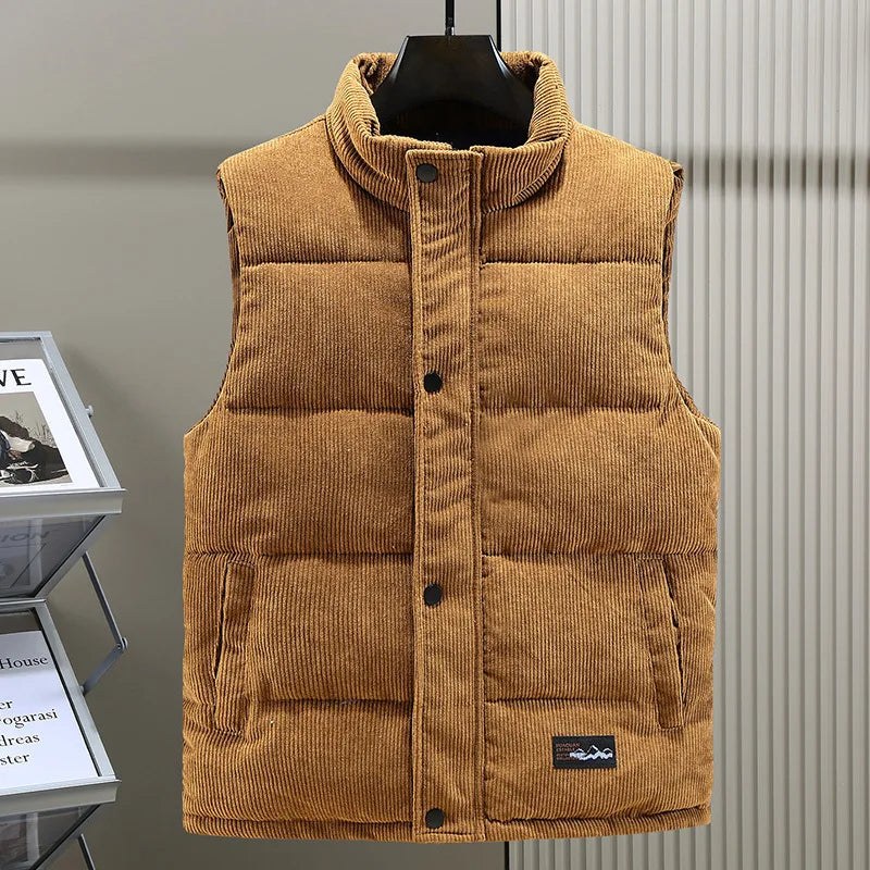 Detail of zipper & high collar on Men's Alpine Ribbed Puffer Vest, a warm and stylish fall outerwear.