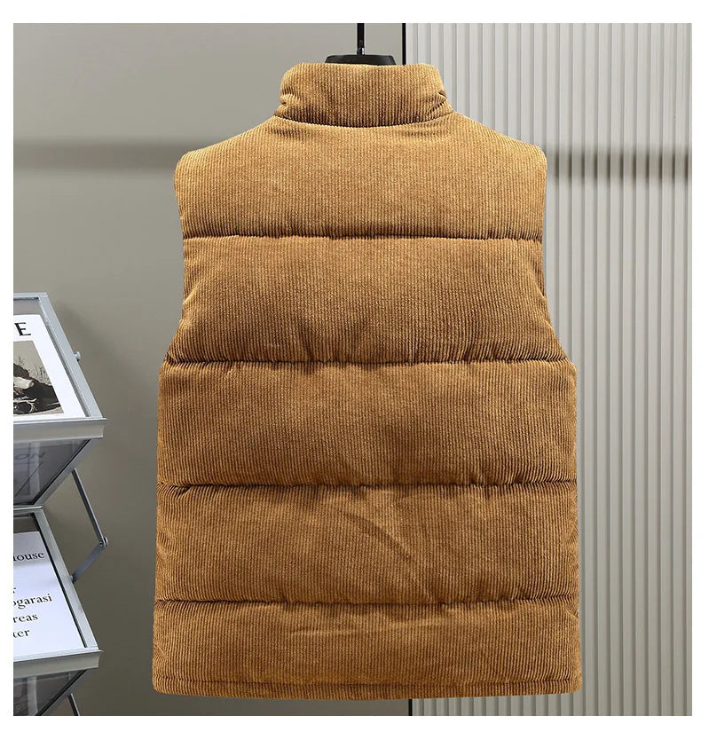 Man walking outdoors wearing a stylish Men's Alpine Ribbed Puffer Vest, perfect for fall adventures.