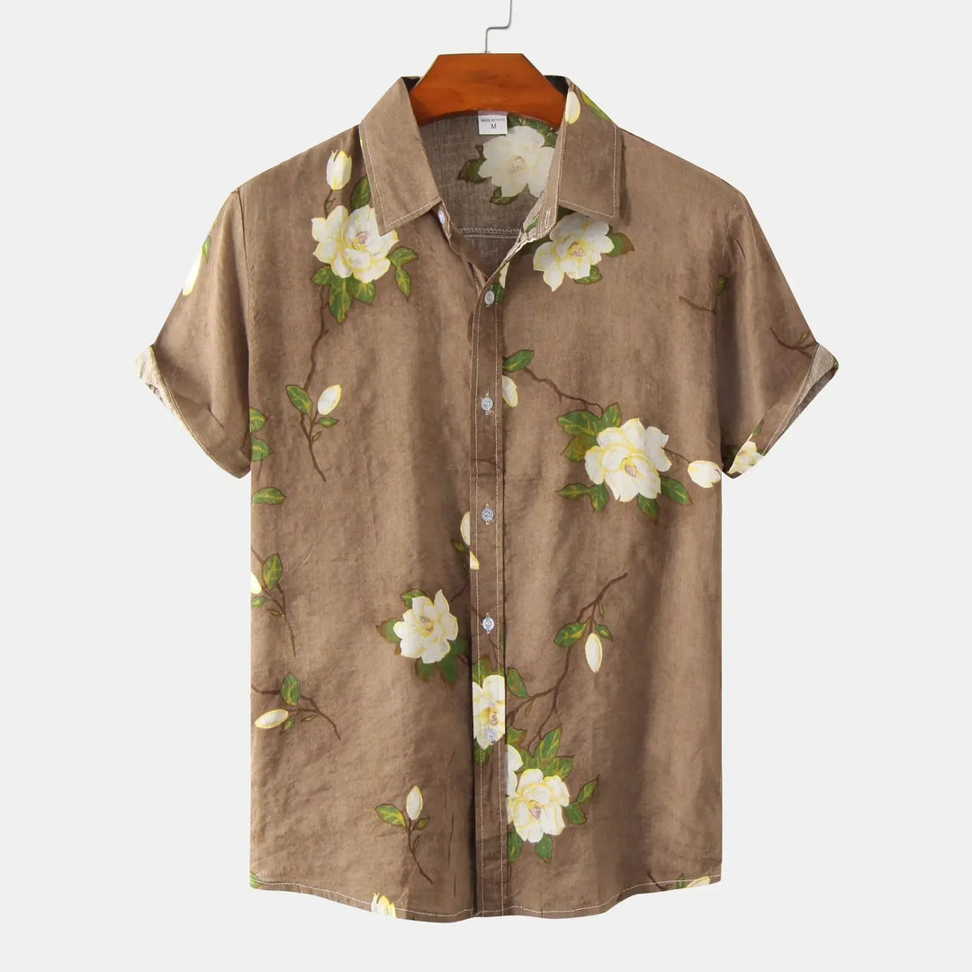 Stylish men's summer floral shirt, button-up & short sleeve. Relaxed fit for casual resort wear or vacation comfort.