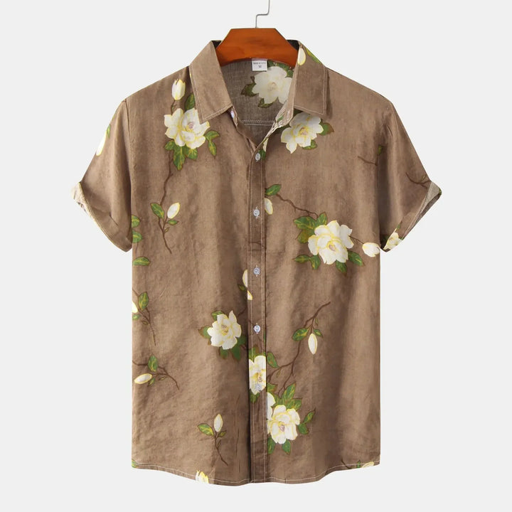 Stylish men's summer floral shirt, button-up & short sleeve. Relaxed fit for casual resort wear or vacation comfort.