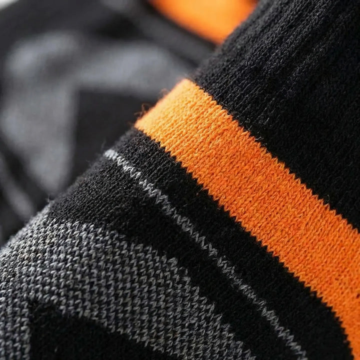 Multi-pack of men's cushioned ankle socks, perfect for athletic activities like hiking & training.