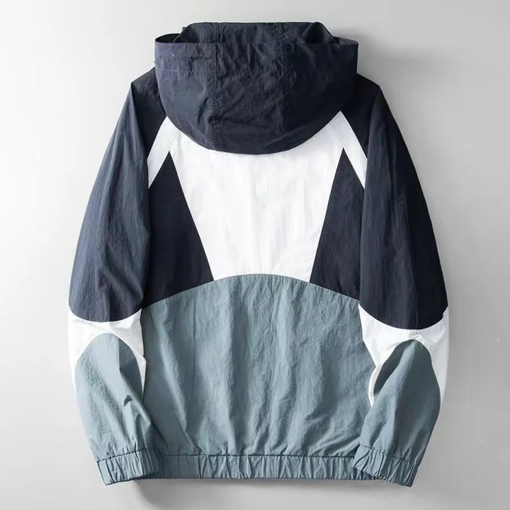 Casual men's Apex windbreaker with stylish blue & yellow color block. Lightweight, weather-ready outerwear.