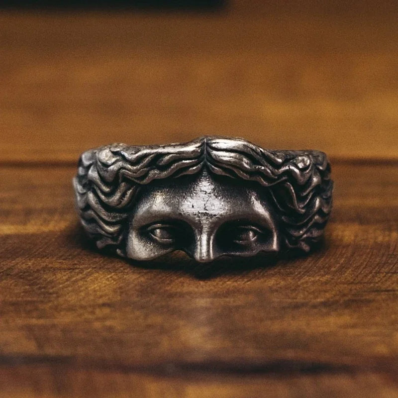 Bold men's stainless steel crown ring in vintage gold finish. Adjustable, Aphrodite inspired statement jewelry.