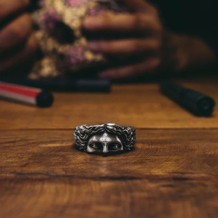 Intricate men's silver tone Aphrodite crown ring. Vintage style, adjustable stainless steel, unique accessory.