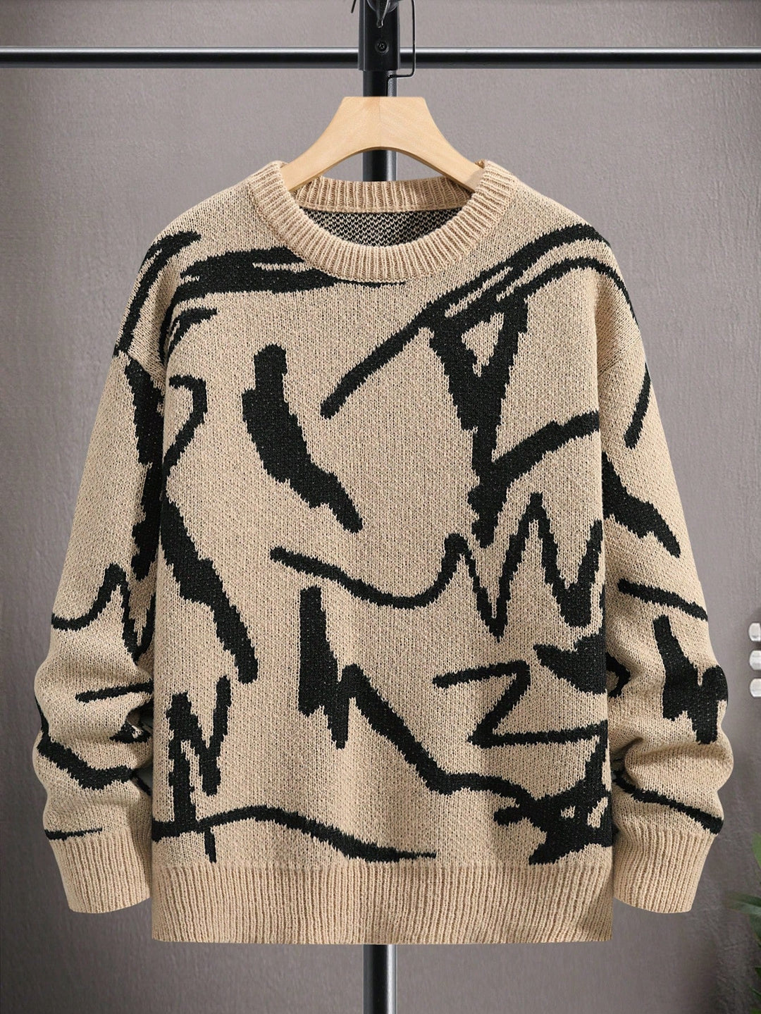 Close-up of the geometric graphic print on the men's Arvid comfortable long sleeve sweater.