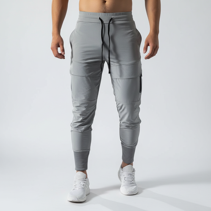 Model wearing comfortable navy blue slim fit joggers, suitable for gym or everyday wear