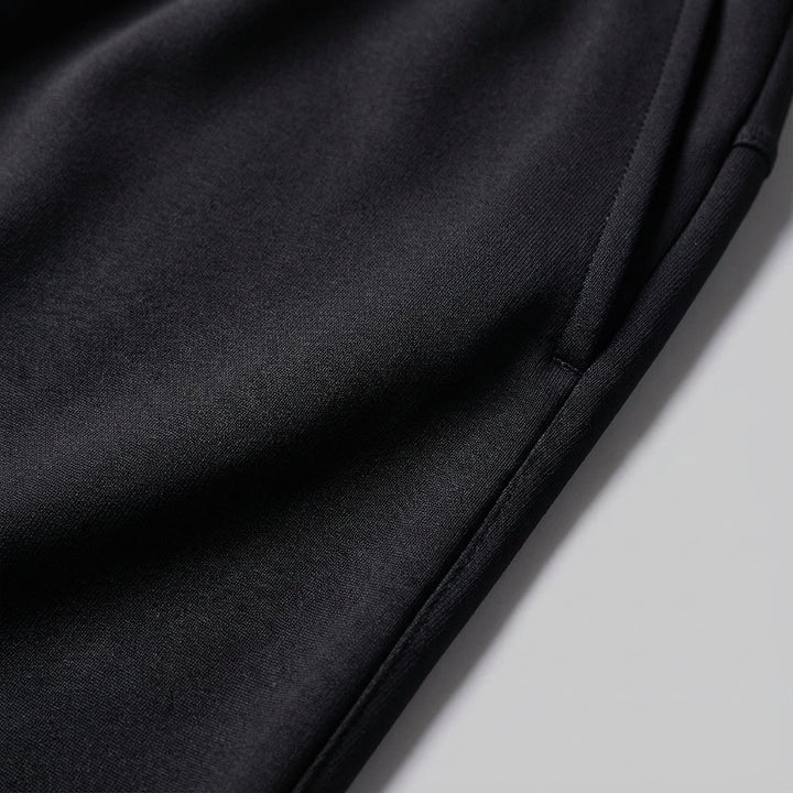 Sporty men's joggers, tapered fit with elastic waistband, suitable for activewear and casual use.