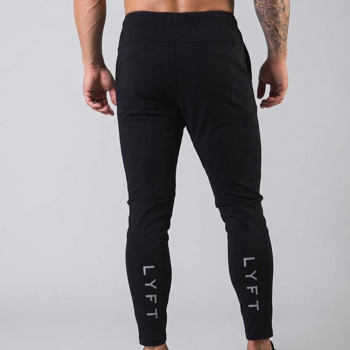 Fashionable men's sportswear joggers, tapered design, elastic waist, perfect for active or casual wear.