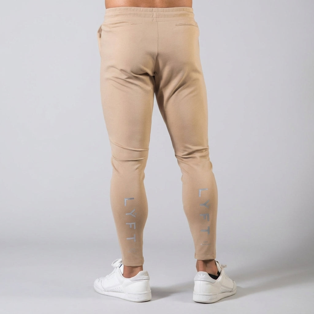 Men's activewear tapered joggers, elastic waist for a secure fit, great for sports and casual style.
