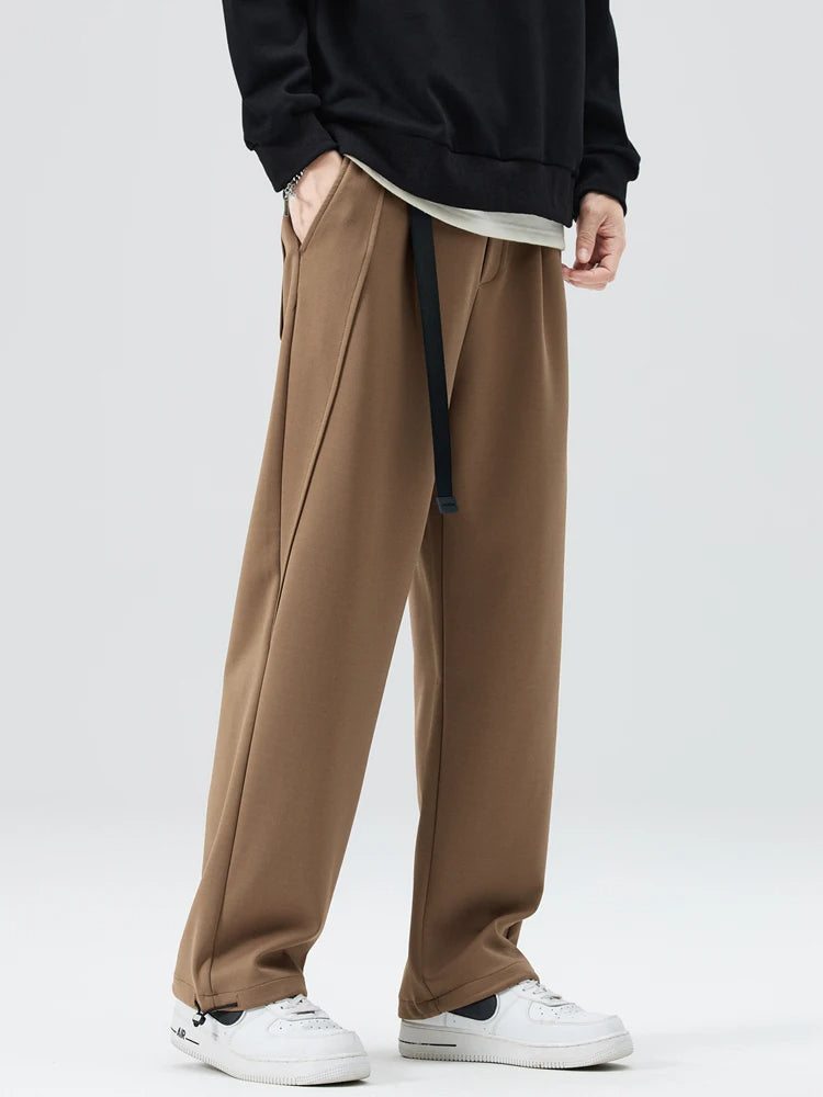Full-length view of men's Atlas wide-leg trousers, demonstrating relaxed fit, casual elegance & comfort.