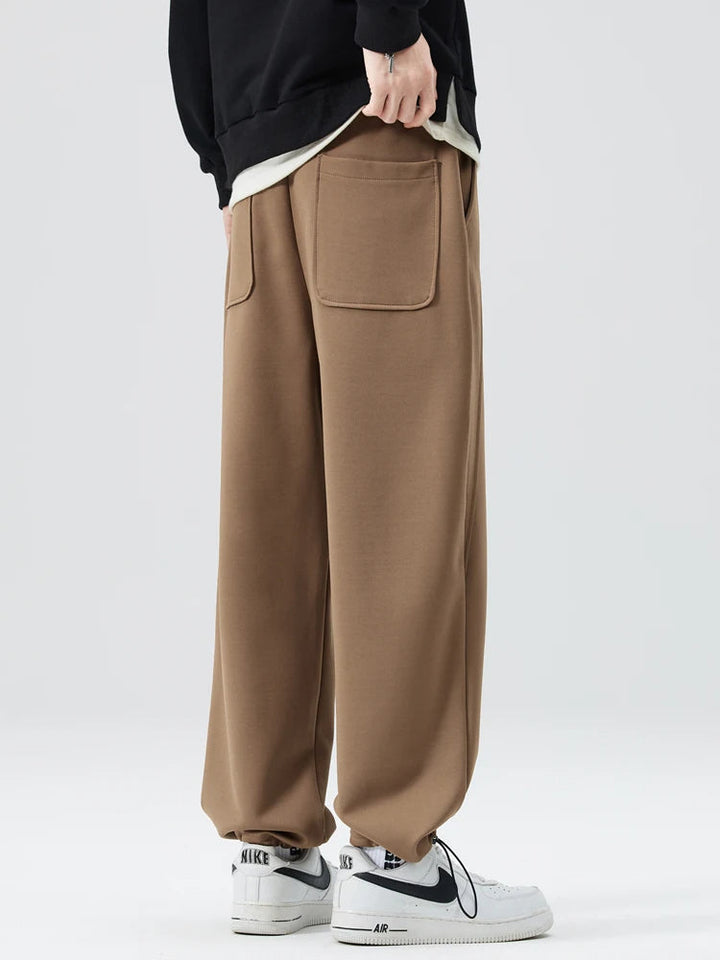 Back view of men's Atlas wide-leg casual pants, showing comfortable fit, relaxed style & pocket detail.