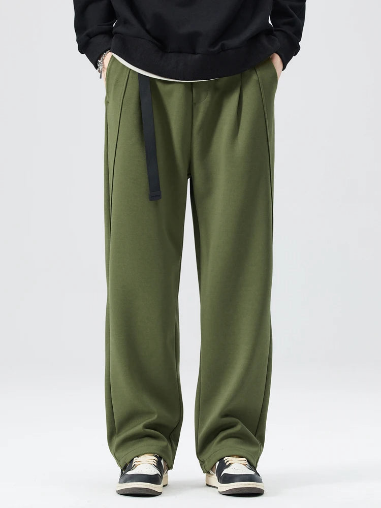 Folded men's Atlas wide-leg trousers, wrinkle-resistant fabric, ready for stylish everyday comfort.