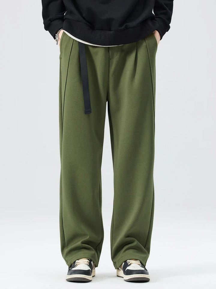 Folded men's Atlas wide-leg trousers, wrinkle-resistant fabric, ready for stylish everyday comfort.