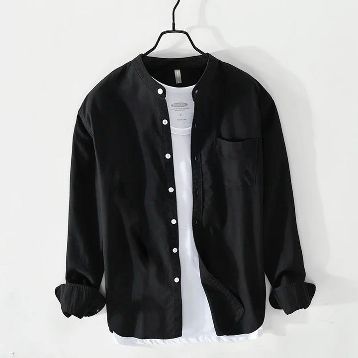 Stylish man wearing a long-sleeve Aura Style Classic Casual Shirt, perfect for modern casual men's fashion.