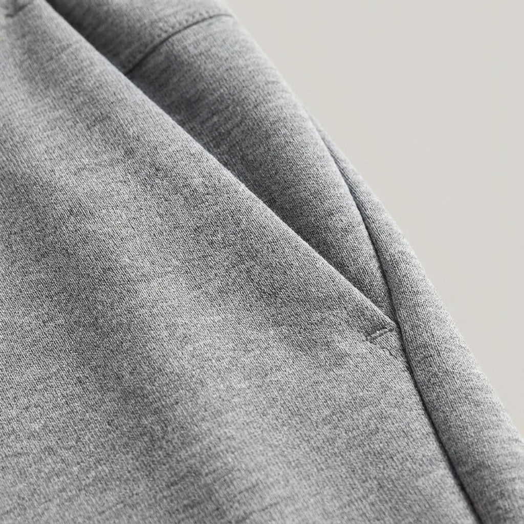 Close-up of men's performance Austin jogging trousers, showing stretch fabric and slim fit design