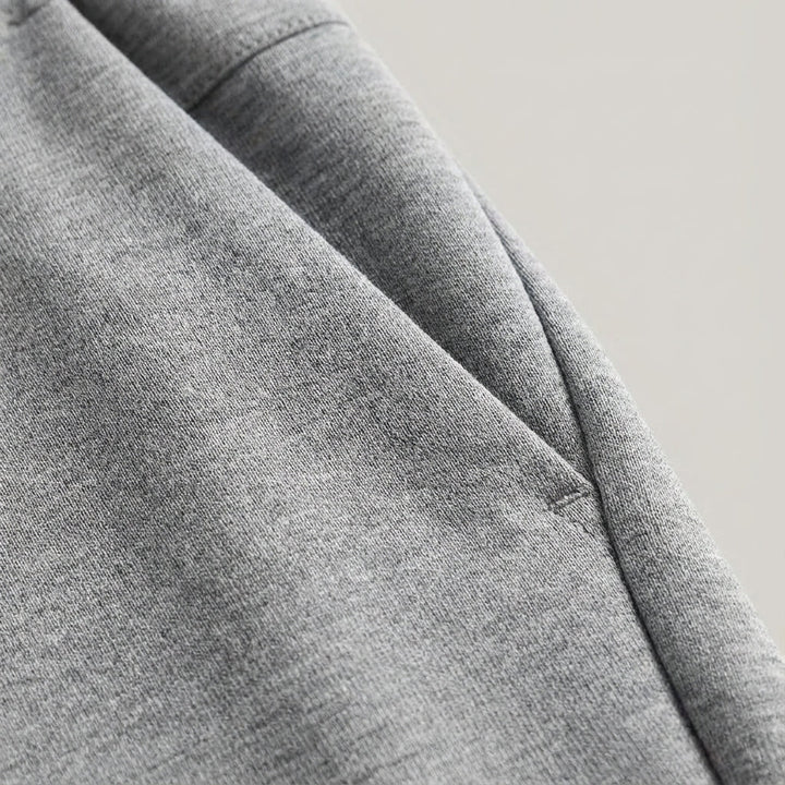 Close-up of men's performance Austin jogging trousers, showing stretch fabric and slim fit design
