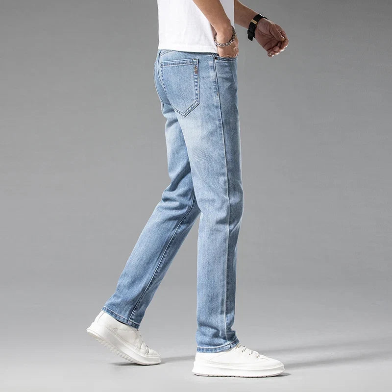 Close-up of Aven men's slim-fit blue stretch denim, showcasing modern texture & comfort.