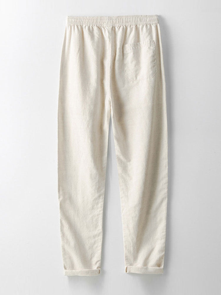 Full view of beige men's matching slim fit linen outfit. Two-piece co-ord with short sleeve top & ankle pants.