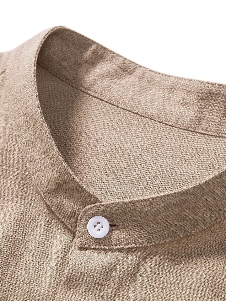 Black men's two-piece slim fit linen set. Modern short sleeve top and comfortable ankle pants for smart casual wear.