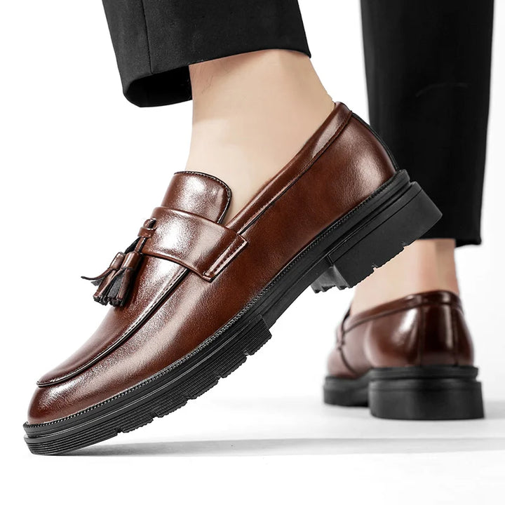 Men's Belmont tassel loafers in polished leather, perfect for sophisticated business casual attire.
