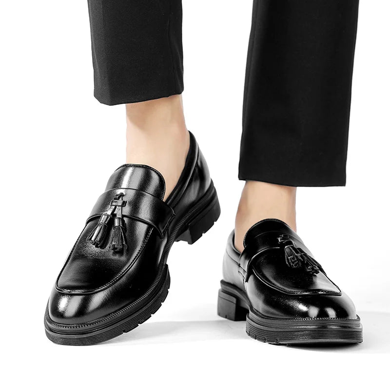 Classic men's slip-on tassel loafers for formal occasions and elegant dress shoe styling.