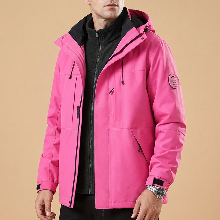 Stylish man wearing a warm Belmont jacket in snowy outdoors, ideal protective winter outerwear for cold weather.