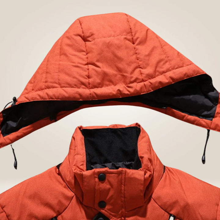 Man in snow wearing a comfortable, all-weather insulated men's winter coat, ultimate cold protection.