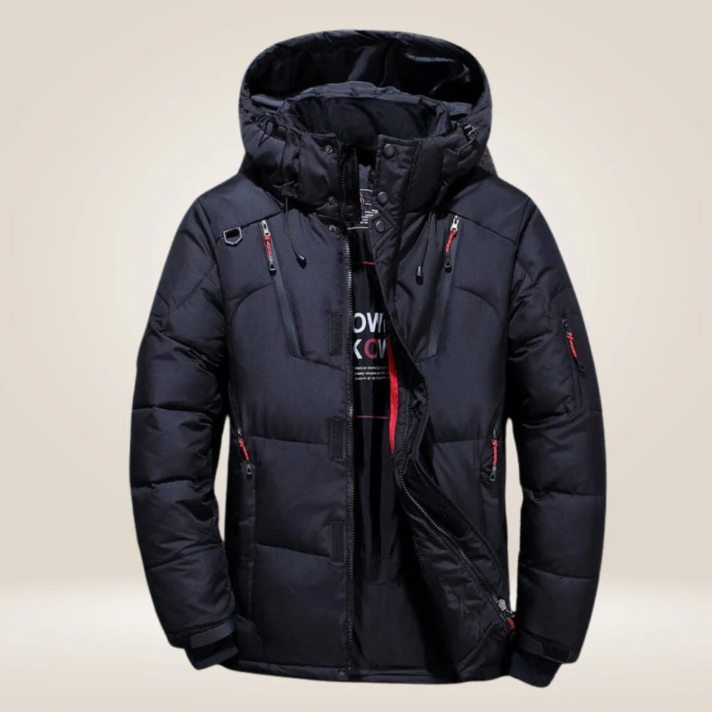 Man hiking in warm, hooded, insulated men's winter coat, all-weather waterproof protection for outdoor wear.