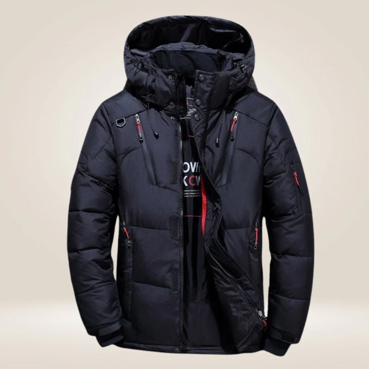 Man hiking in warm, hooded, insulated men's winter coat, all-weather waterproof protection for outdoor wear.