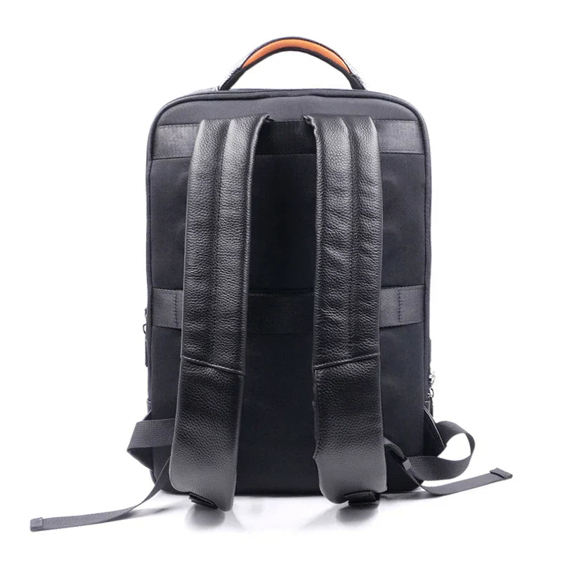 Secure men's anti-theft travel bag: a durable black leather backpack with a convenient fingerprint lock.
