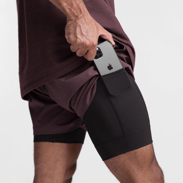 Model wearing Marky men's athletic shorts during a run, showcasing comfort & flexibility