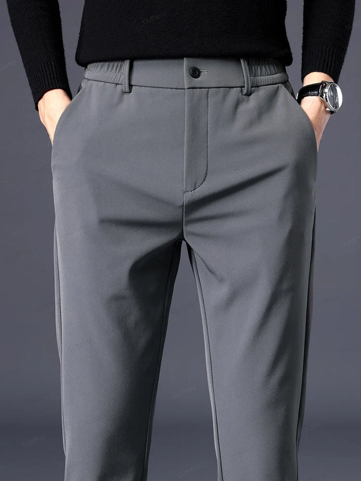 Men's black classic fit comfort pants with elastic waist, ideal for versatile dress or casual wear.