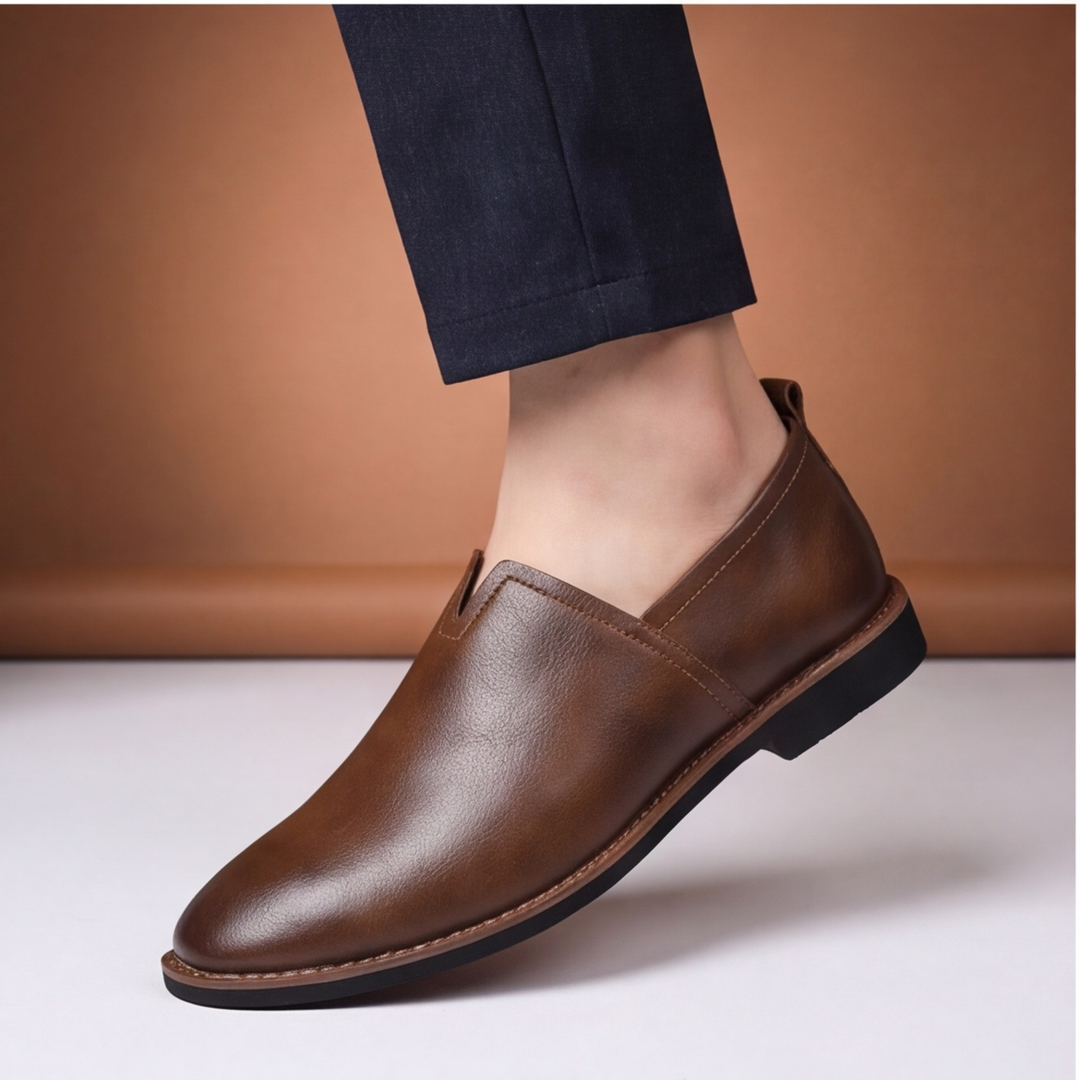Pair of men's black slip-on loafers, classic, comfortable footwear for any occasion.