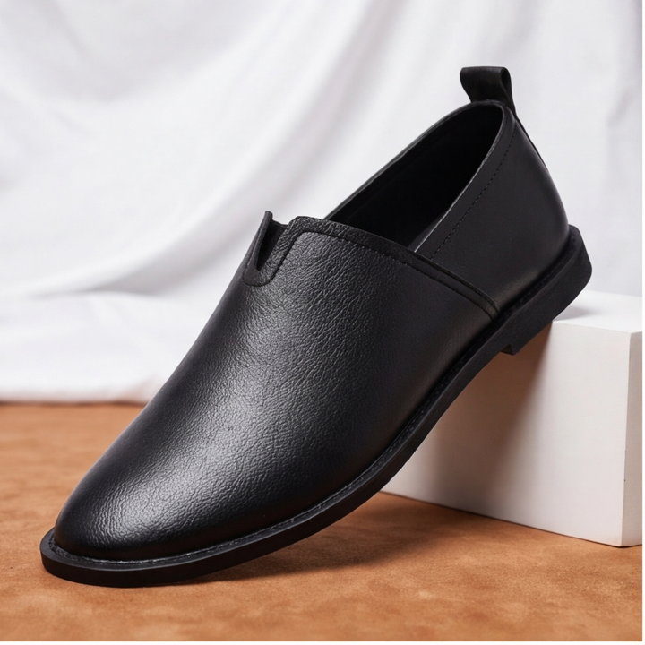 Detailed view of men's slip-on loafers, sleek design, comfortable & classic style.