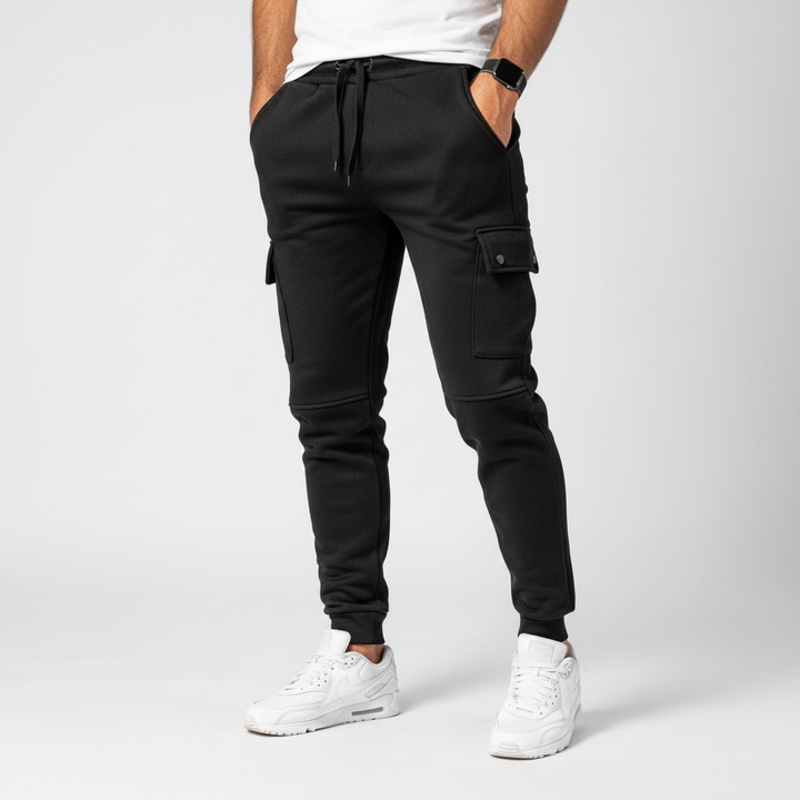 Breathable men's cropped joggers, dark green, with discreet pocket. Ideal for an active lifestyle.