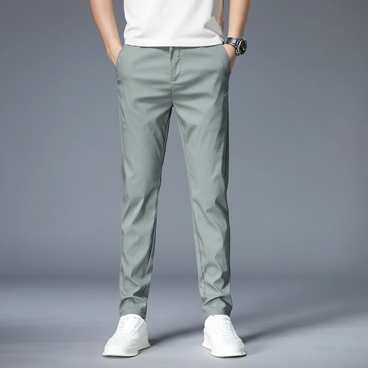Stylish men's black elastic waist slim fit trousers paired with a shirt, ideal for various occasions.