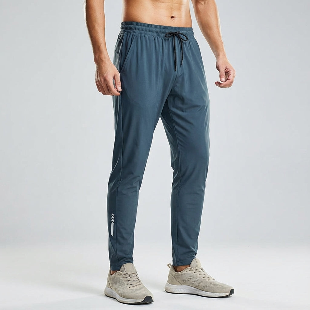 Vince men's athletic training joggers in navy, showcasing elasticity and ideal for sportswear.