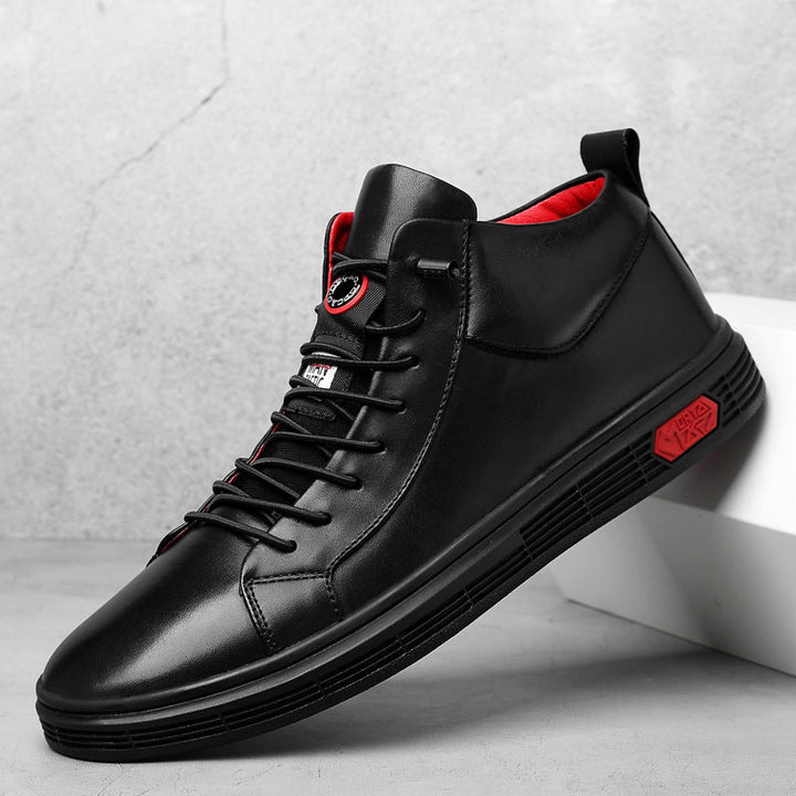 Versatile men's black high-top casual footwear, sporting red accents, suitable for various stylish looks.