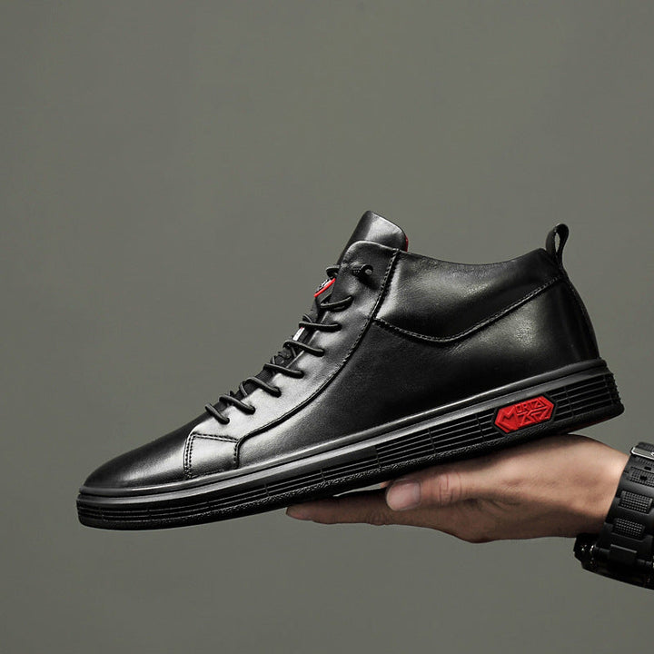 New men's black high-top casual shoes with striking red accents, combining comfort & contemporary style.