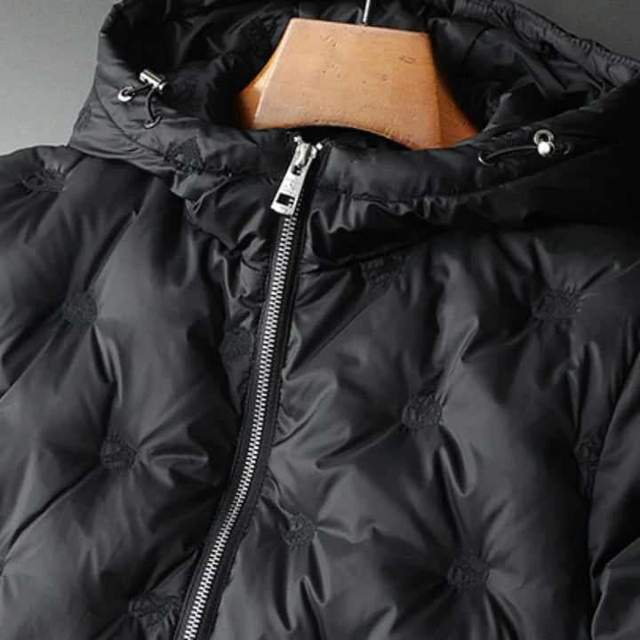 Cozy men's insulated black puffer jacket, perfect for winter outdoor activities & cold weather fashion.