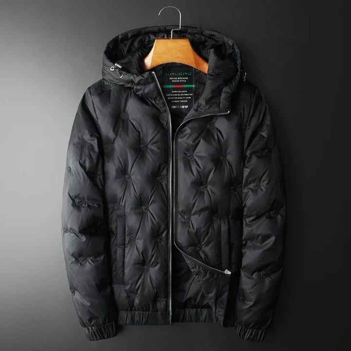 Durable men's black insulated puffer jacket, offering superior warmth. Quilted winter fashion for men.