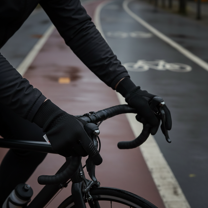 Men's black insulated winter gloves with touchscreen fingertips, ideal for cold weather cycling and outdoor gear.