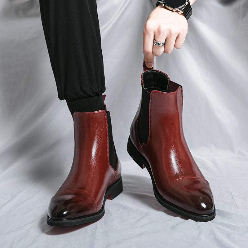 Modern men's ankle boots: sophisticated Chelsea style with elastic gussets and a striking red sole.